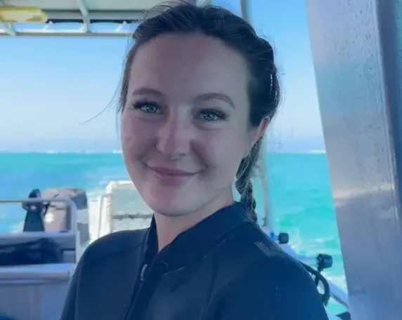 Abigail-Headshot-2025-scaled-e1744030236327-572x456